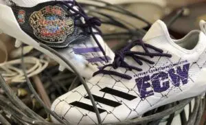 NFL Player Sports ECW-Themed Cleats During Game