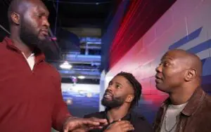 Cedric Alexander & Shelton Benjamin Try To Recruit Omos Into The Hurt Business WWE Refers To Cedric Alexander & Shelton Benjamin As The Hurt Business With No Explanation