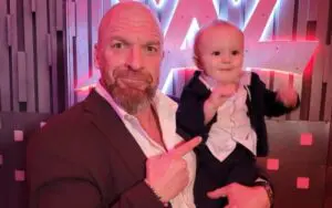 Triple H Takes Signature Point Photo With Johnny Gargano & Candice LeRae's Son Quill