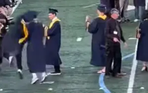 Graduating Student Hits An RKO On Friend During Ceremony Graduating Student Hits An RKO On Friend During Ceremony