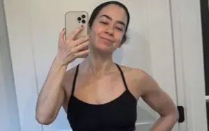 AJ Lee Shows Off Arm Gains To Display Amazing Physical Stature