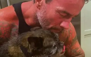 CM Punk Scans Larry’s Paw Print For Action Figure in Behind-The-Scenes Video