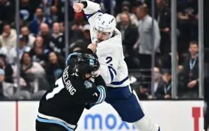 Toronto Maple Leafs’ Simon Benoit Uses Roman Reigns’ Superman Punch in NHL Fight