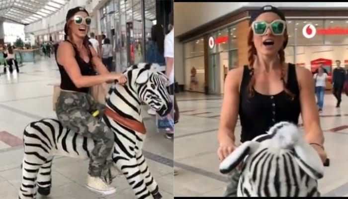 Watch Becky Lynch Ride Around Shopping Mall On A Giant Toy Zebra