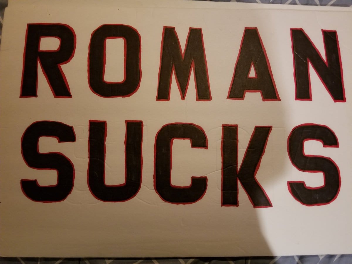 WWE Security Snags Anti-Roman Reigns Sign At Raw In Denver