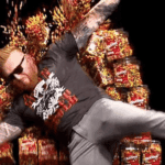 Watch Cathy Kelley Throw Heath Slater Through Wall Of Skittles