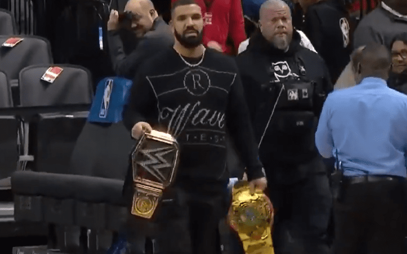 Drake Shows Up At NBA Game With 2 WWE Titles
