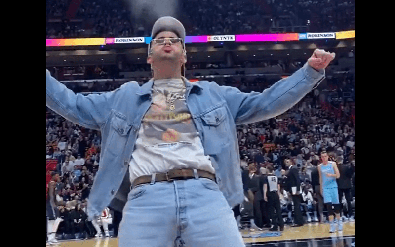 Rapper Bad Bunny Recreates Triple H’s Iconic Water Spit At NBA Game
