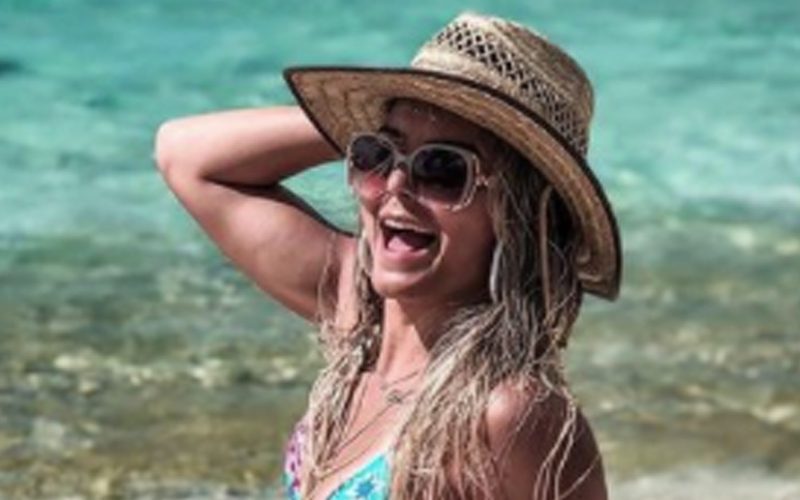 Tay Conti Drops Stunning Beach Photo To Fight Cold Weather