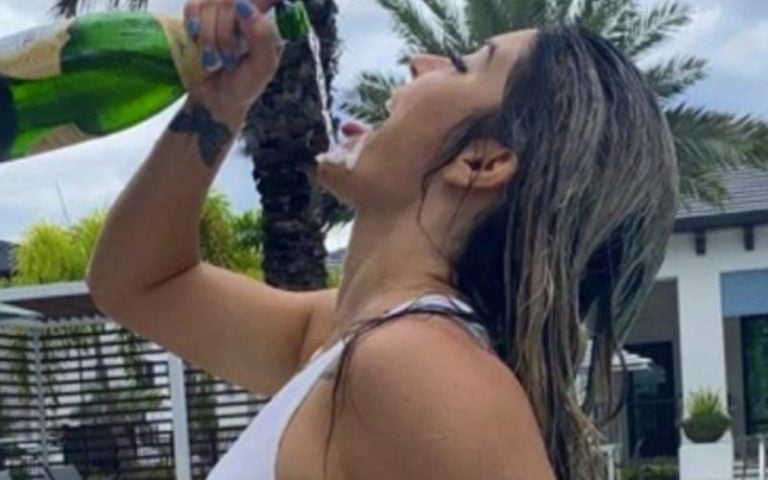 Tay Conti Living Her Best Life & Guzzling The Bubbly In Steamy Photo Drop
