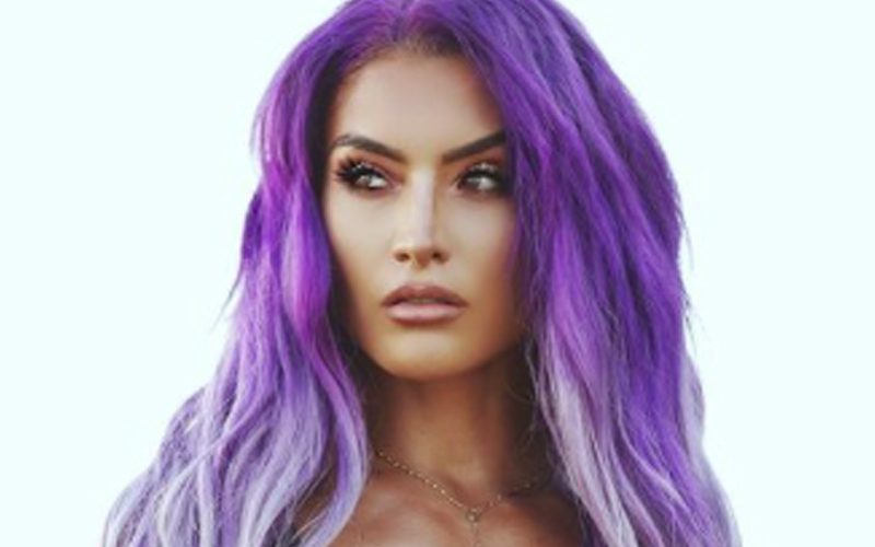 Eva Marie Shows Off Purple Hair In Breathtaking One-Piece Swimsuit Photo