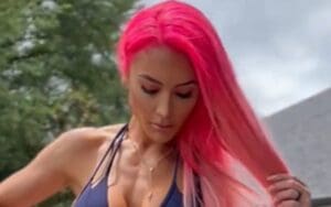 Eva Marie Sprays Herself Down While Straddling ATV In Behind-The-Scenes Video