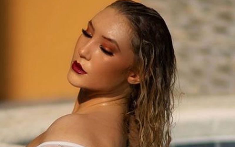 Nikkita Lyons Takes A Dip In Sultry White Swimsuit Poolside Photo Drop
