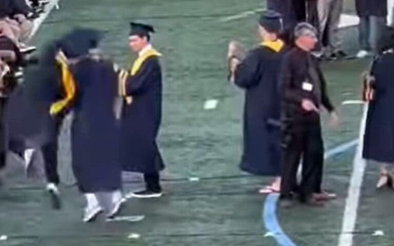 Graduating Student Hits An RKO On Friend During Ceremony