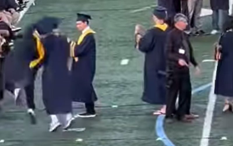 Graduating Student Hits An RKO On Friend During Ceremony