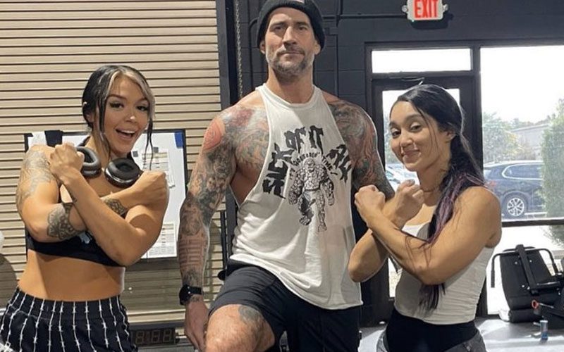 CM Punk Poses With Cora Jade & Roxanne Perez For Priceless Photo Drop