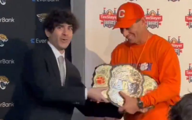 Tony Khan Presents AEW World Title to Clemson Tigers After Gator Bowl Win