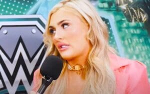 Individual Behind Tiffany Stratton's Entrance Theme Change