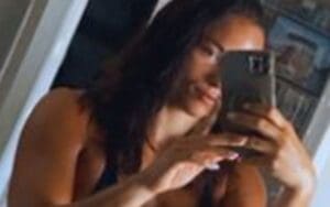 WWE's Kiana James Displays Toned Physique in Mirror Selfie After Pool Dip