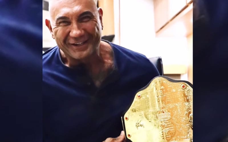 Batista Gifts Custom WWE World Title to ‘The Killer’s Game’ Director