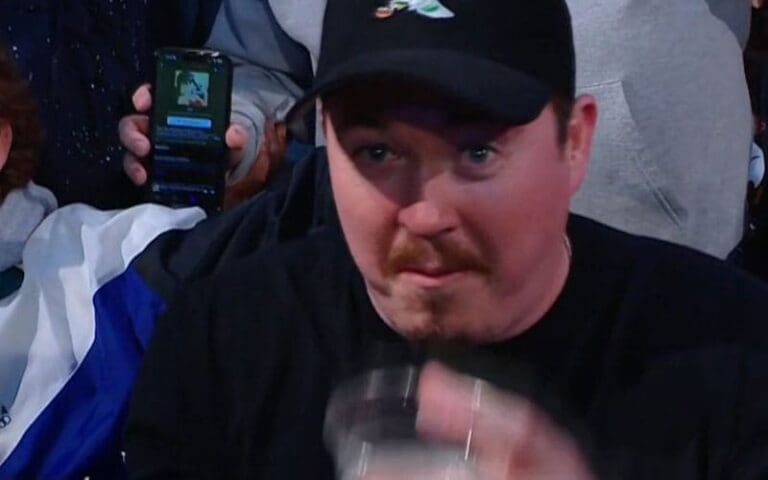 Shane Gillis Chugs a Beer at Ringside During WWE SmackDown in Austin, Texas