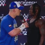 John Cena Attacks R-Truth With Attitude Adjustment During WWE Backlash Press Conference